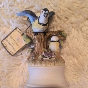 Bird Figurine on Tree Stump